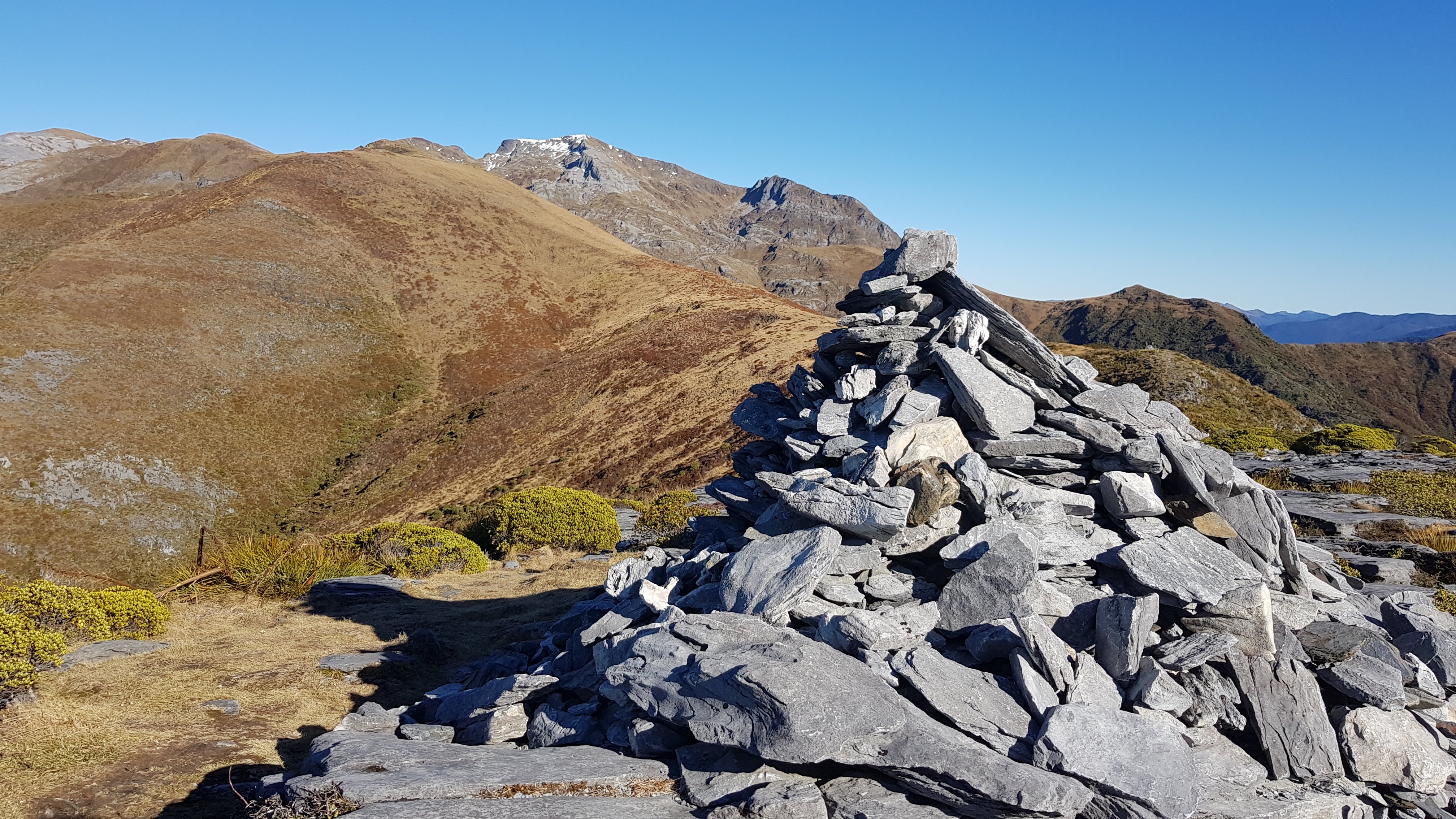 The big cairn with Mount Arthur in the distance