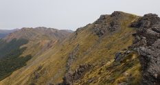 Traversing some of the rocky outcrops along the ridge of the Lockett Range