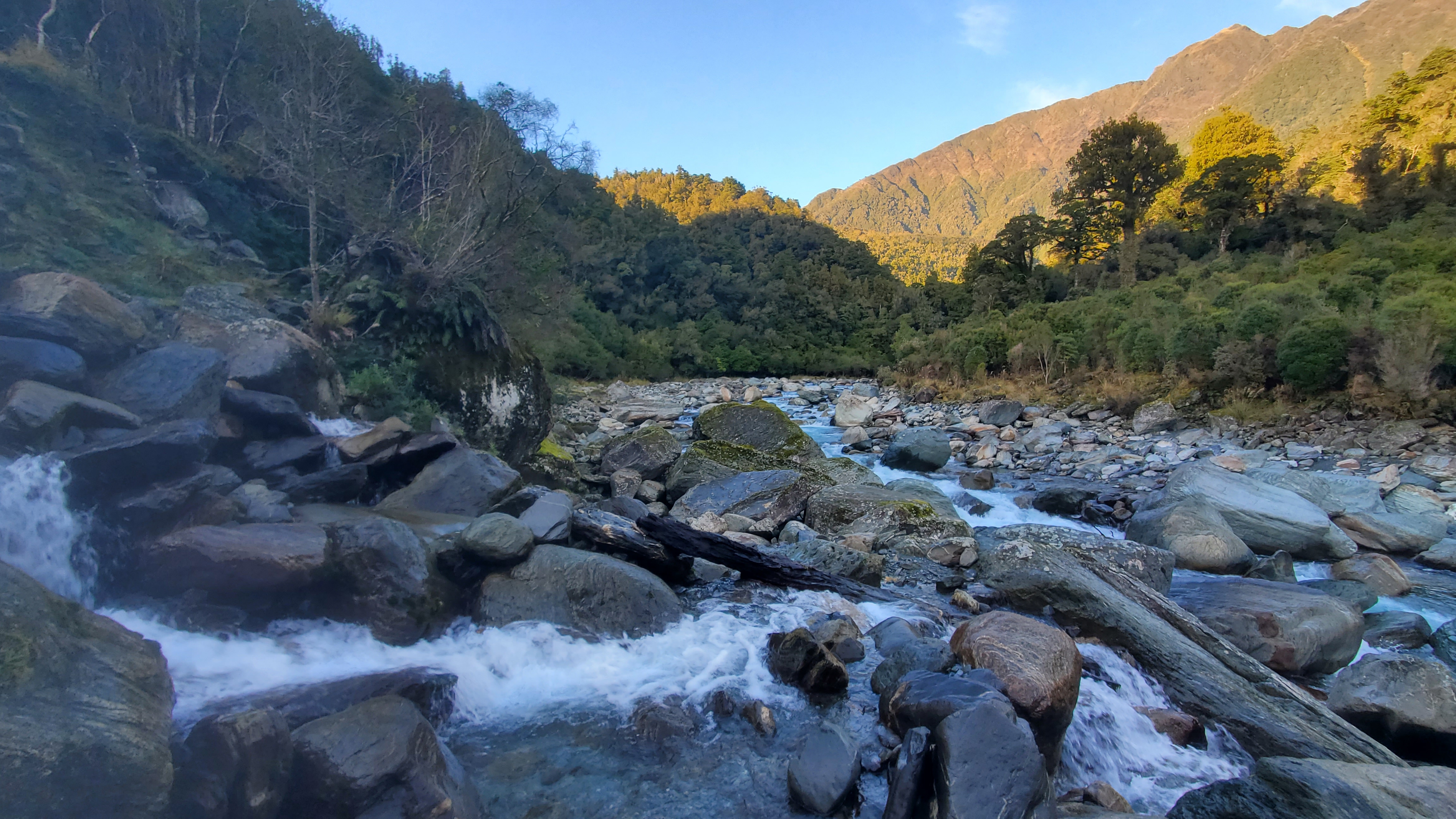 Crossing the side stream above the boulders along the Toaroha River