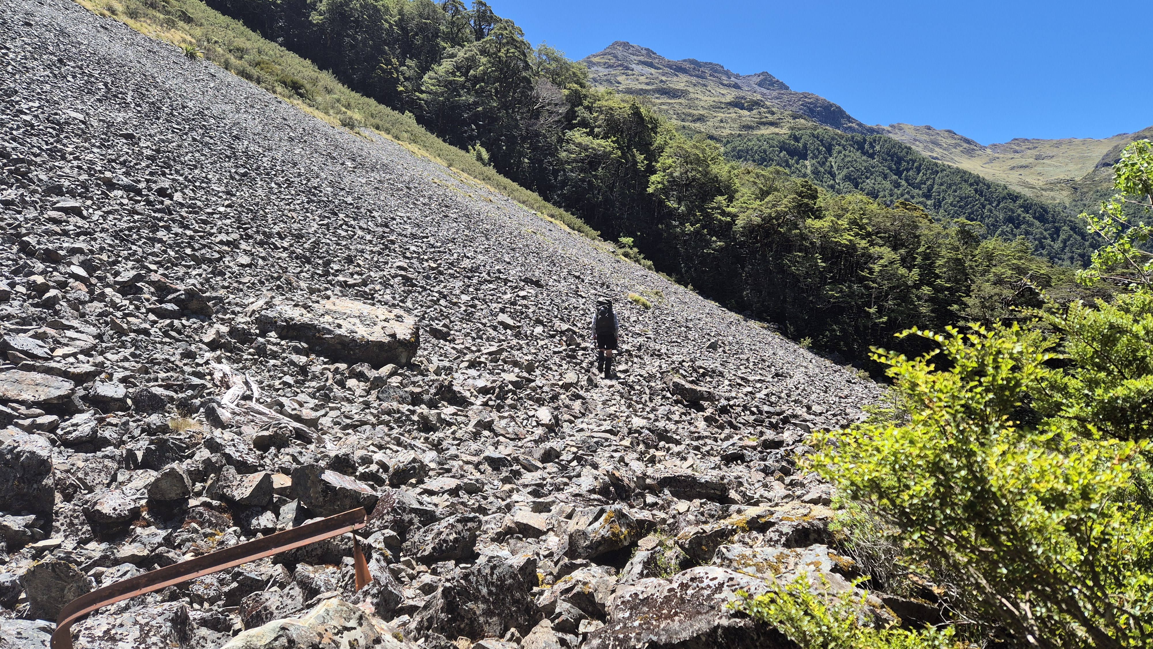 Crossing the larger scree slope, towards Lake Christabel hut from the Robinson